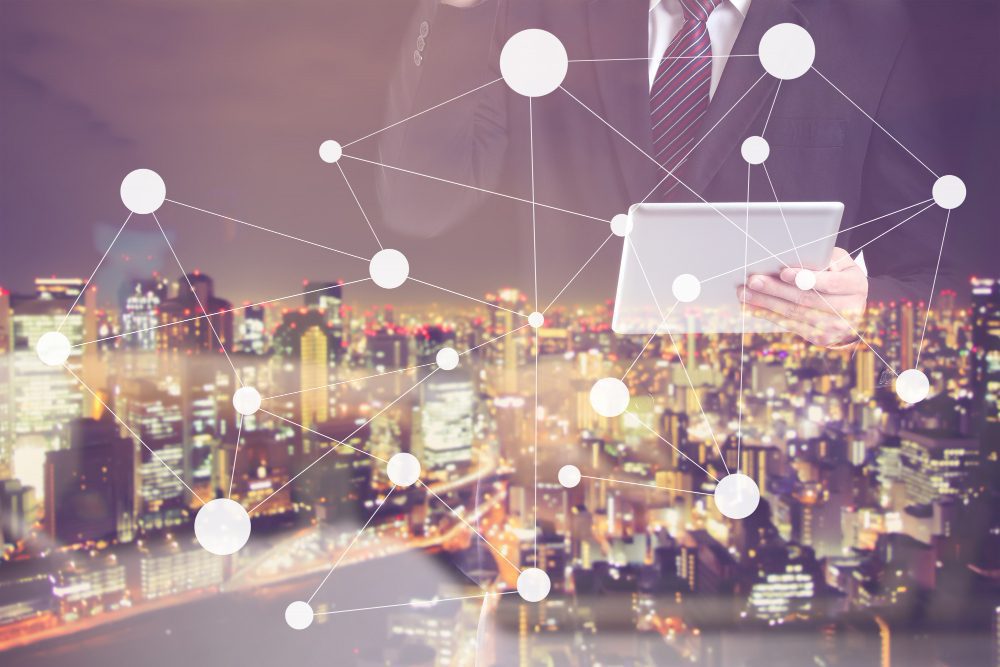 Business professional using tablet with global network connection